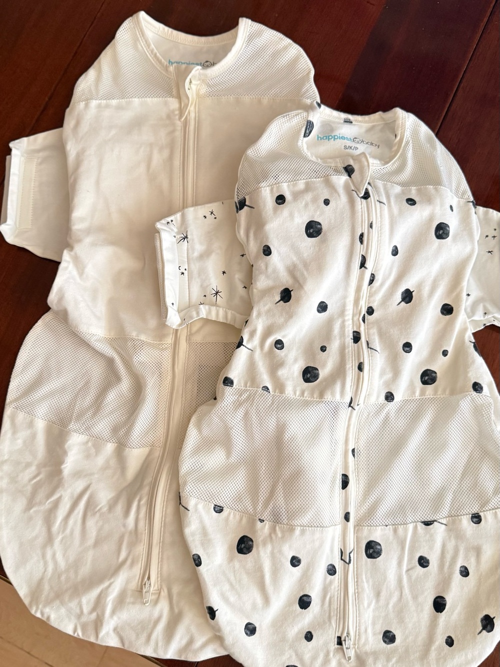 2 lightly used Snoo Sleep Sacks - 1 size Small, 1 Size Medium.